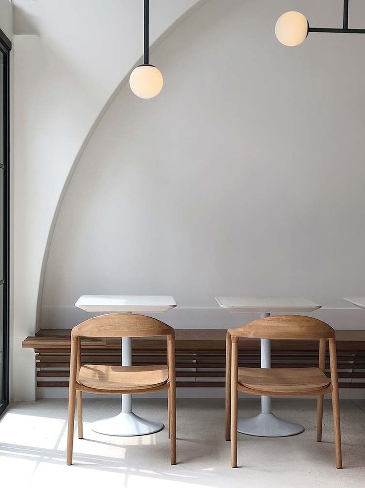 Inviting Minimalist Cafe Design with Elegant Features and Natural Light