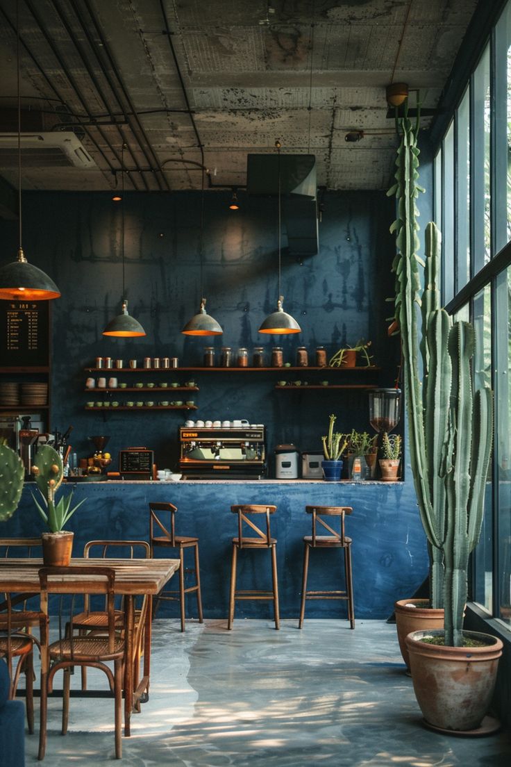 Modern Cafe Design: Calming Ambiance with Deep Blue Walls and Natural Touches