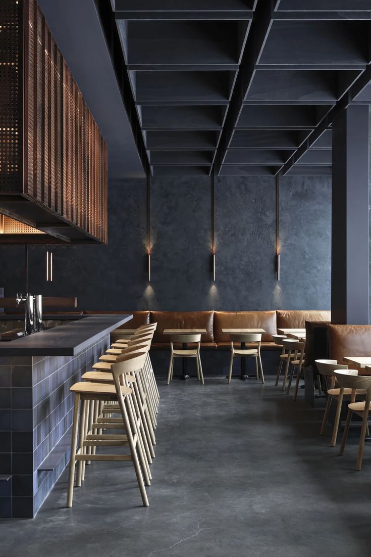 Modern Minimalistic Cafe Design: Sophisticated Atmosphere with Deep Blues, Earthy Tones, and Functional Seating