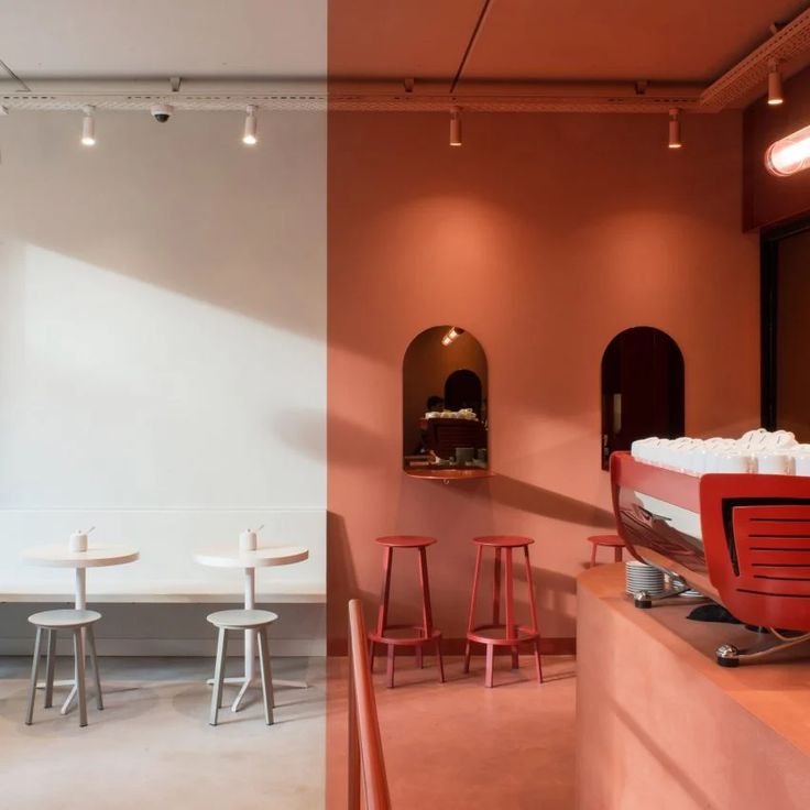 Contemporary Cafe Design: Minimalist Aesthetic with Natural Light and Vibrant Focal Points