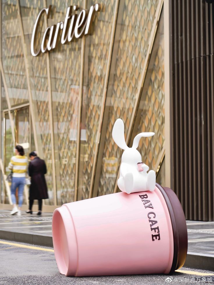 Whimsical Cafe Scene with Overturned Pink Cup and Charming Rabbit Figure